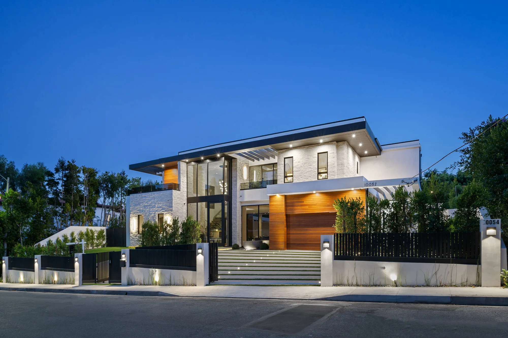 modern luxury house exterior illuminated at dusk 2026 01 07 23 12 16 utc